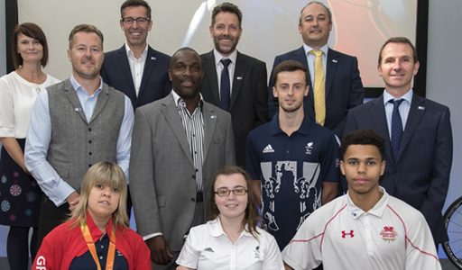 Group of people smiling with athletes