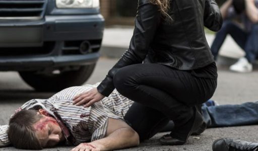 Man lying on the floor after car accident