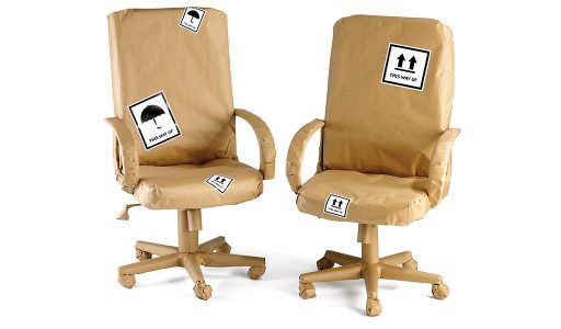 Office chairs wrapped in brown paper
