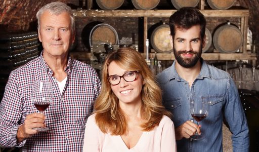 Father, son and daughter in winery